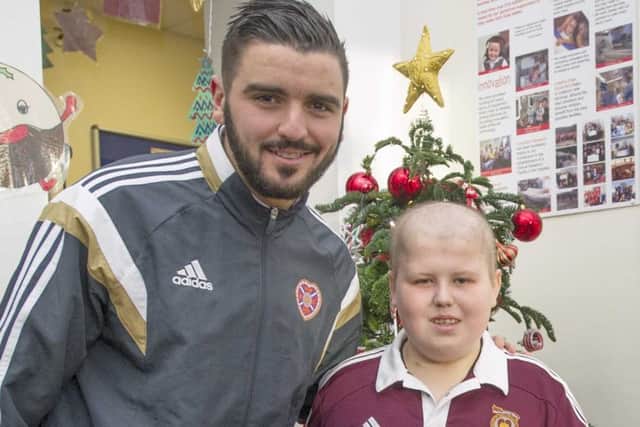 Peter Ashton with Hearts captain Alim Ozturk