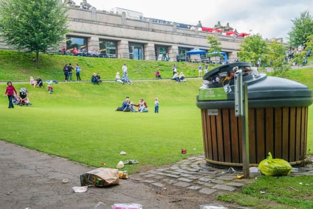 Bins overflow leaving rubbish across Princes Street Gardens East. Picture: Ian Georgeson