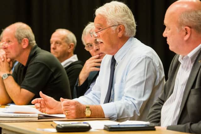Ken Shade addresses the meeting of residents opposed to the Ravelrig Road development. Picture: Ian Georgeson