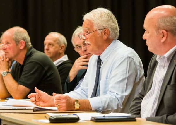 Ken Shade addresses the meeting of residents opposed to the Ravelrig Road development. Picture: Ian Georgeson