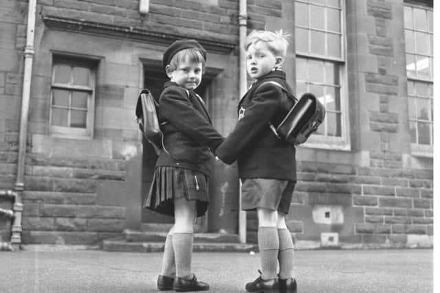 First day at school - 5-year-olds Linda Cormack andf John Boyle outside Preston Primary School in Edinburgh, April 1966.