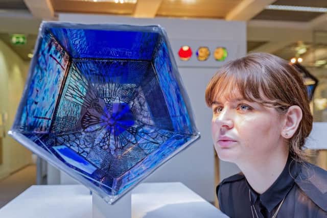 Edinburgh College of Art's Kathryn Dunlop looks at Aimee McCulloch's stained glass work. Picture: Malcolm McCurrach