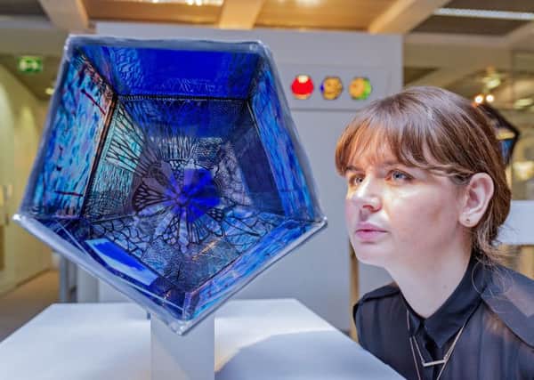 Edinburgh College of Art's Kathryn Dunlop looks at Aimee McCulloch's stained glass work. Picture: Malcolm McCurrach