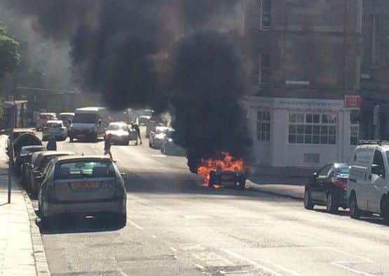The car on fire. Picture: Sarah Drummond