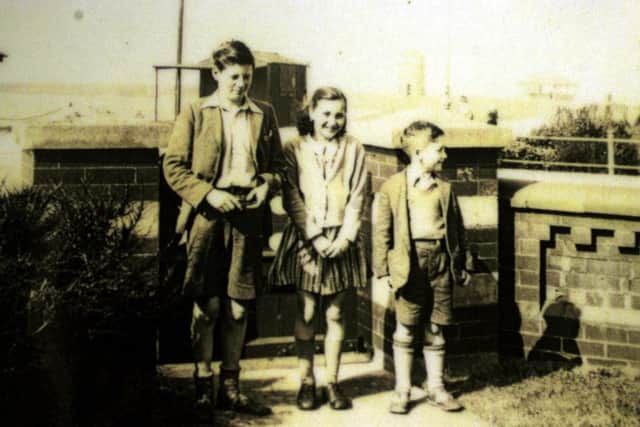 From left, Stan Parkes, cousin Leila and John Lennon, aged seven