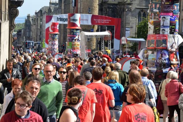 The High Street is packed with Fringe-goers. Picture: Jon Savage