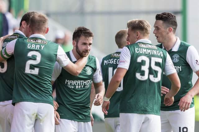 James Keatings, centre, is congratulated by his team-mates. Picture: SNS