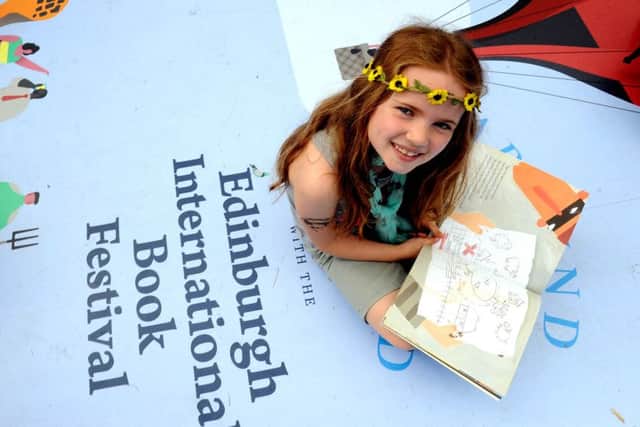 Eight-year-old Robyn enjoys the Edinburgh International Book Festival, which has been hailed as the most successful in the event's history. Picture: Lisa Ferguson