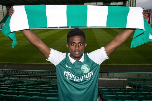 Islam Feruz celebrates signing a season-long loan deal with Hibs
