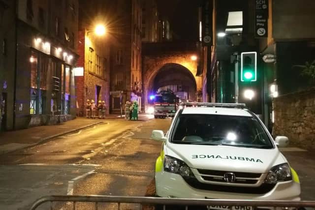 Paramedics attend the scene in the Old Town.Picture: Jason Andreas