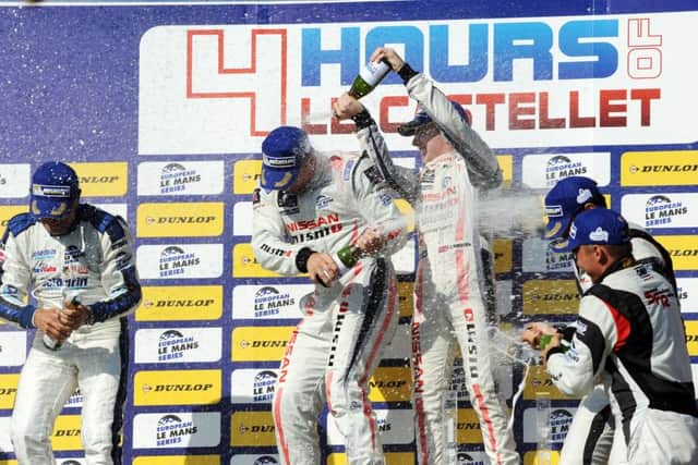 Chris Hoy is drenched by his teammates after winning Le Mans. Picture: Contributed