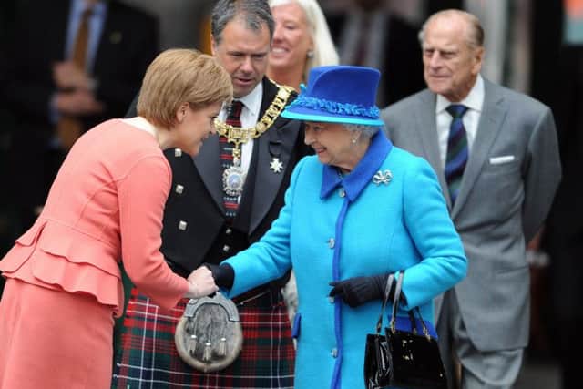 Nicola Sturgeon greets the Queen. Picture: Neil Hanna
