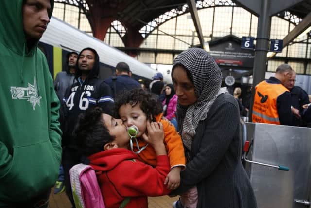 Syrian migrants arrive at main train station in Copenhagen on their way to Sweden. Picture: AP
