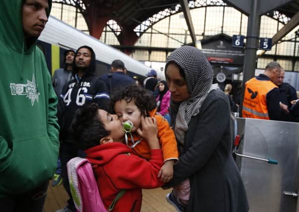 Syrian migrants arrive at main train station in Copenhagen on their way to Sweden. Picture: AP