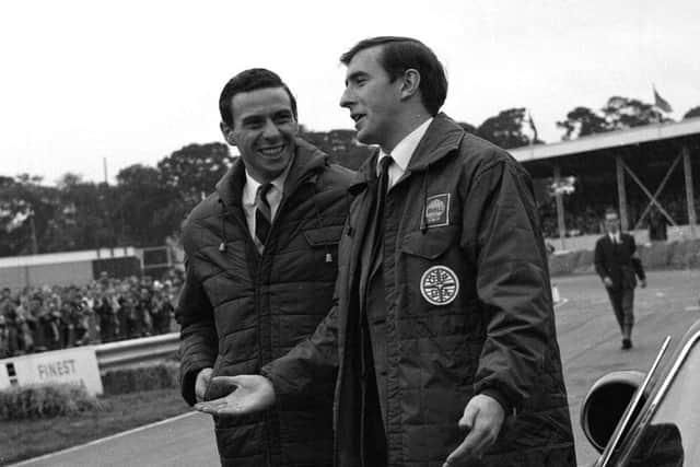Jim Clark talks to Jackie Stewart at the Ingliston car show in 1961. Picture: TSPL