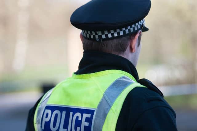 Four men impersonating police officers entered the woman's home in Bathgate.
