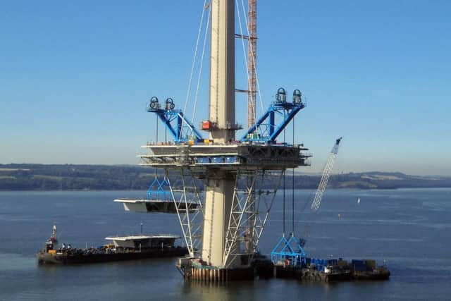 An 800 tonne deck unit is lifted into place on the Queensferry Crossing's north tower. Picture: PA