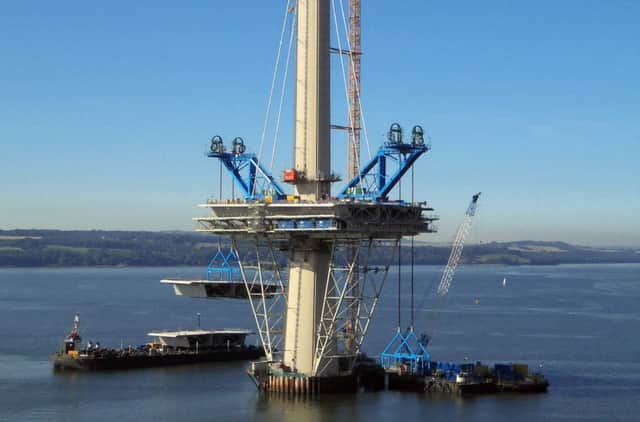 An 800 tonne deck unit is lifted into place on the Queensferry Crossing's north tower. Picture: PA