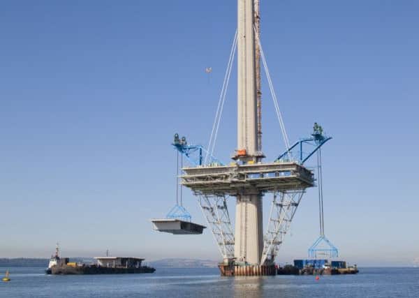 An 800 tonne deck unit is lifted into place on the Queensferry Crossing's north tower. Picture: PA