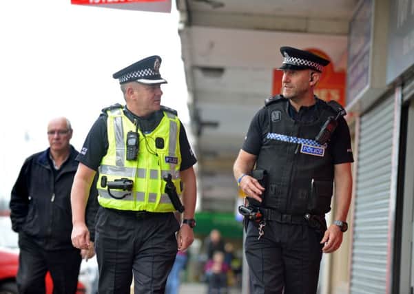 Stephen Sutherland and Kevin Weaver on the beat in Drylaw. Picture: Jon Savage