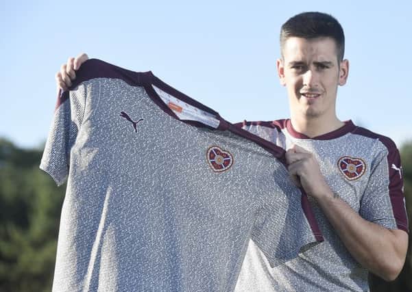 Jamie Walker models the kit which features 8000 names. Picture: Greg Macvean