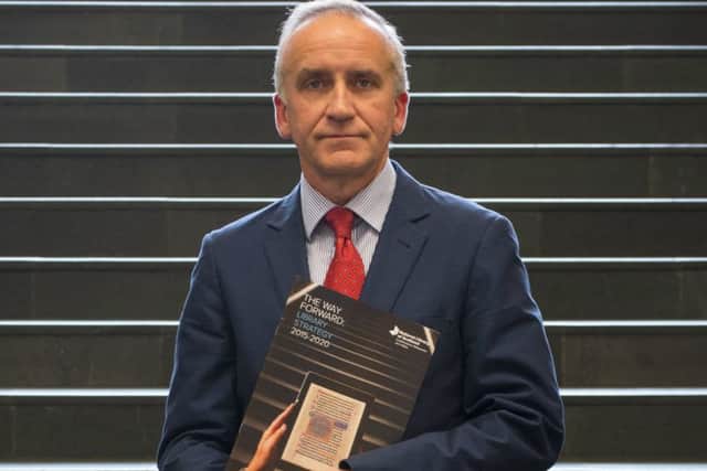 National Librarian Dr John Scally with a copy of the new strategy.
Picture: National Library of Scotland