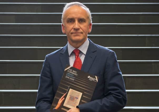 National Librarian Dr John Scally with a copy of the new strategy.

 Picture: National Library of Scotland