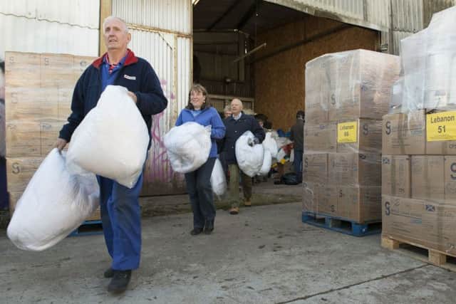 EDA volunteers load up the donations. Picture: Andrew O'Brien