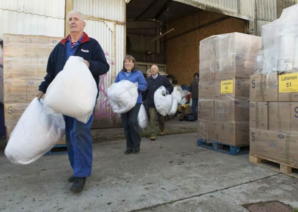 EDA volunteers load up the donations. Picture: Andrew O'Brien