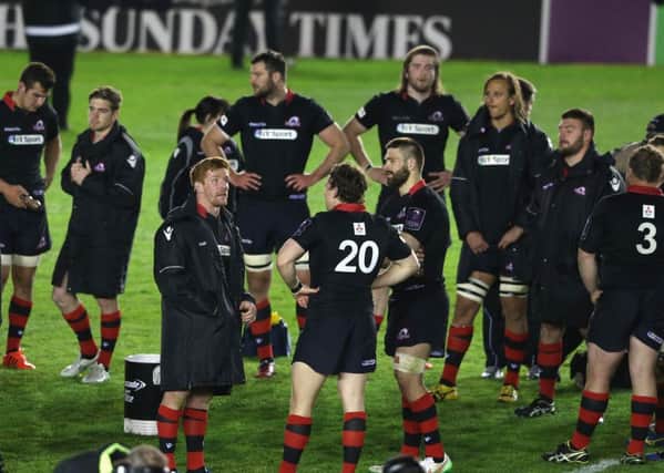 Edinburgh players look dejected after their defeat during the European Rugby Challenge Cup Final match against Gloucester in May.
