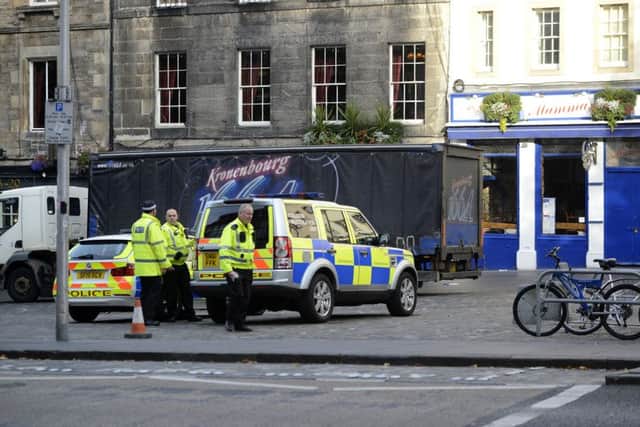 Police closed the Grassmarket to traffic while they investigated. Picture: Julie Bull