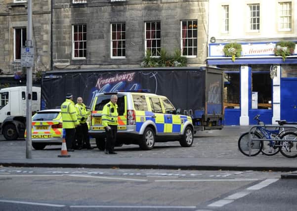 Police closed the Grassmarket to traffic while they investigated. Picture: Julie Bull