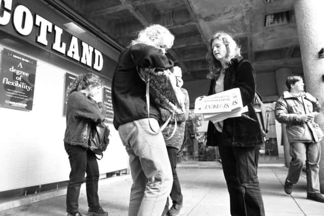 A student buying a student newspaper at Edinburgh University in October 1993.