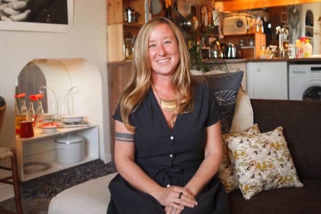Carrie Maginn in her flat. She has been both Airbnb host and customer. Picture: Toby Williams