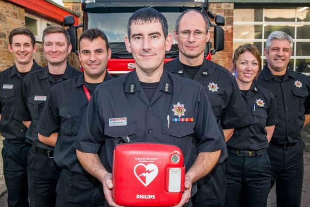 Musselburgh Fire Station commander Tony Collins and the rest of his Greenwatch crew are redy to use their new defibs. Picture: Ian Georgeson
Photographer Ian Georgeson, 07921 567360
Musselburgh Fire Station fire engines now have Defibrillators on them and fire crews will be first responders, Station Commander Tony Collins with the defib and his Greenwatch crew