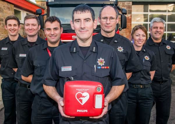 Musselburgh Fire Station commander Tony Collins and the rest of his Greenwatch crew are redy to use their new defibs. Picture: Ian Georgeson


Photographer Ian Georgeson, 07921 567360
Musselburgh Fire Station fire engines now have Defibrillators on them and fire crews will be first responders, Station Commander Tony Collins with the defib and his Greenwatch crew