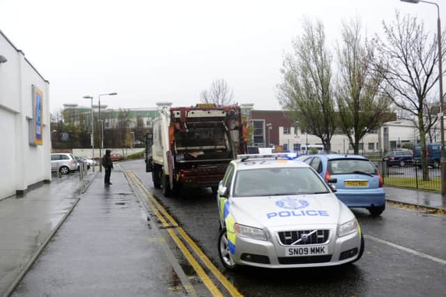 Police are investigating after the bin lorry hit a pedestrian. Picture: Julie Bull