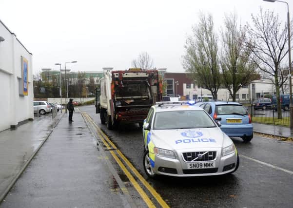 Police are investigating after the bin lorry hit a pedestrian. Picture: Julie Bull