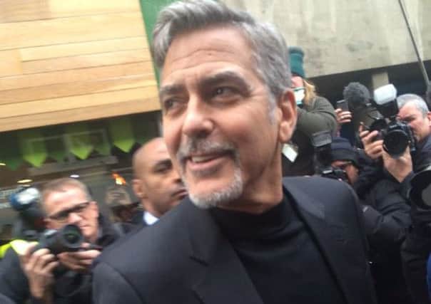 Clooney arrives in Edinburgh.