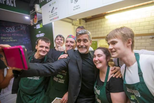 Hollywood A-lister George Clooney takes a selfie when he visited the not-for-profit sandwich shop Social Bite in Edinburgh.