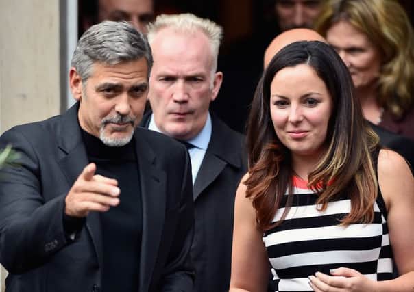 George Clooney, leaves Tiger Lily restaurant after having lunch with Heather McGowan, 32, from Glasgow. Picture: Getty