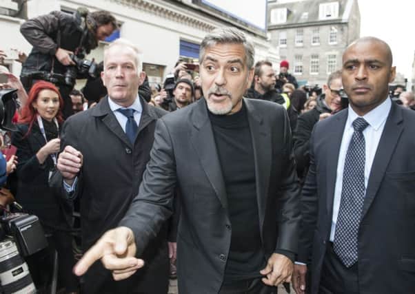 George Clooney visited the Social Bite sandwich shop in Rose Street , which supports homeless people , then moved onto the offices of the Postcode Lottery on George Street.


Picture: Phil Wilkinson