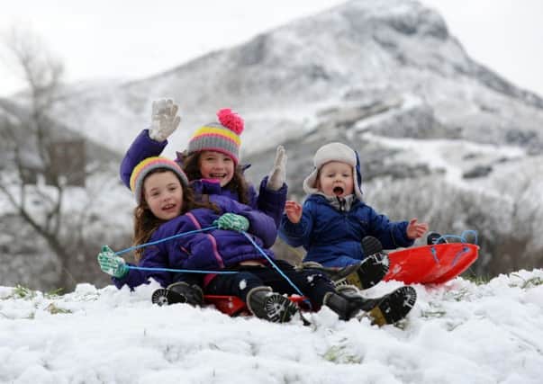 Youngsters enjoy sledging in Holyrood Park. Picture: Jane Barlow