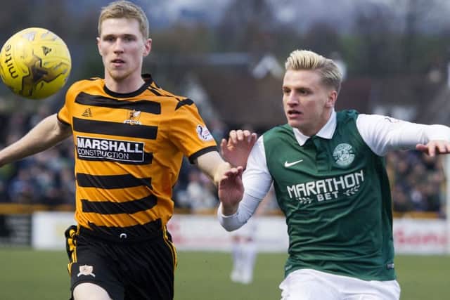 Goalscorer Jason Cummings keeps a close eye on Alloa's Colin Hamilton. Picture: SNS