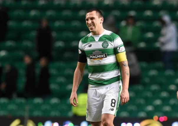 Celtic captain Scott Brown grimaces in pain at the end of Celtic's 0-0 draw with Kilmarnock. Pic: SNS