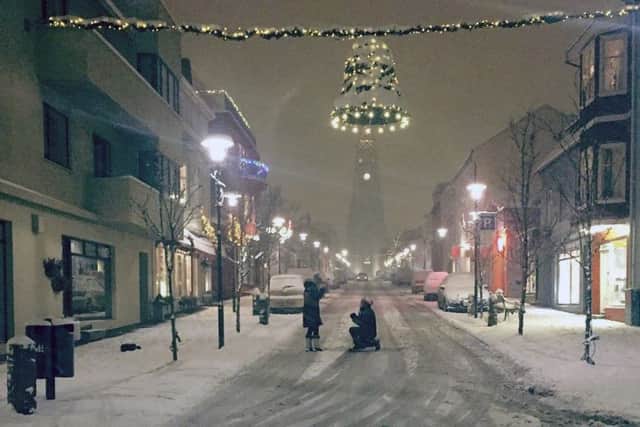 The now-iconic photo of the Reykjavik street, with Michael proposing to Fiona. Picture: Instagram/JRBowe