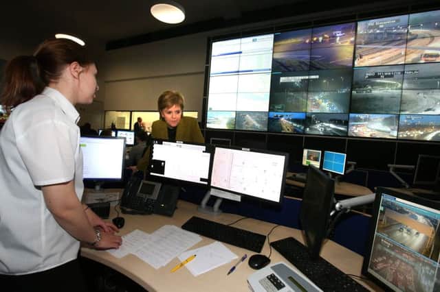 Nicola Sturgeon talks to staff during a visit to the Traffic Scotland Control Centre at South Queensferry. Picture: PA