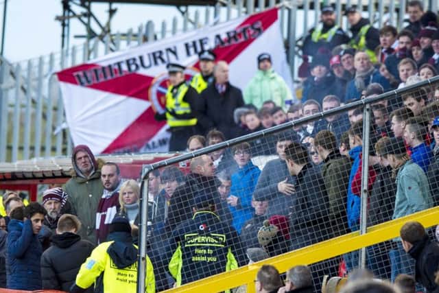 Police and stewards speak to Hearts fans at the match with Aberdeen at Pittodrie. Picture: SNS