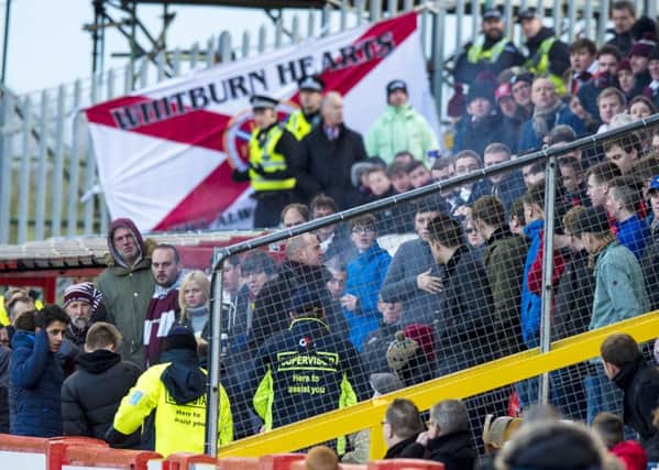 Police and stewards speak to Hearts fans at the match with Aberdeen at Pittodrie. Picture: SNS