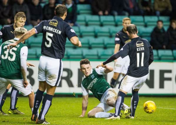 John McGinn's challenge on Mark Kerr has been downgraded to a yellow card. Pic: Ian Georgeson